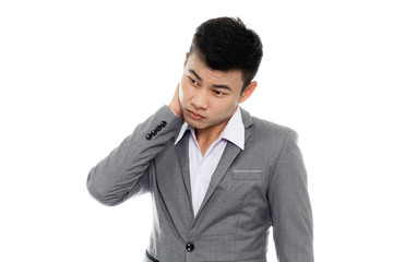 Portrait of a business man having a neck pain. Isolated on white background