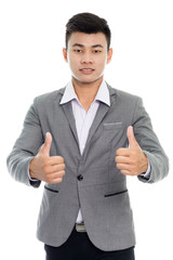 Portrait of a  businessman showing thumbs up. Isolated on white background