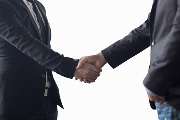 Successful negotiating business concept, Businessmen shaking hands after finishing meeting or setting  goals and planning way to success.