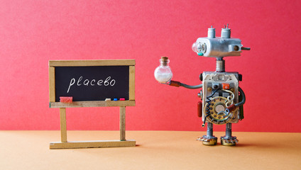 Placebo effect concept Medic robot drugs tube, black chalkboard with handwritten word placebo. Pink wall brown floor background. - obrazy, fototapety, plakaty