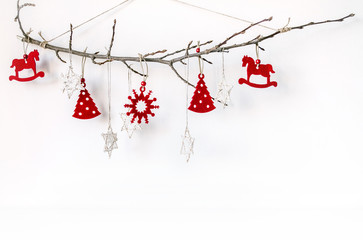 New Year's unusual composition with a branch and Christmas-tree toys. Christmas background for...