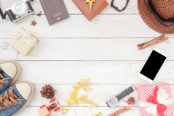 Flat lay aerial image shot of decorations and ornaments Merry Christmas & Happy New Year background concept.Objects on modern rustic white wooden at table studio.Items for traveler to travel trip.