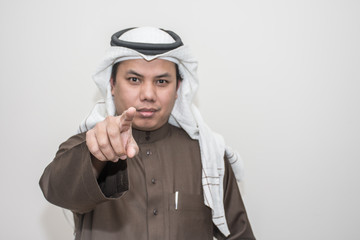 Portrait of Asian man wear the Arab traditional uniform
