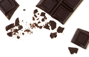 Broken chocolate bar isolated on white