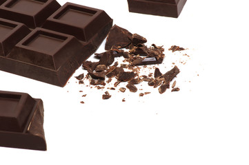 Broken chocolate bar isolated on white