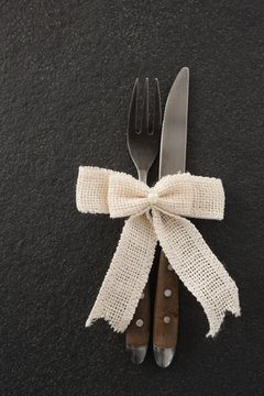 Fork and knife tied with a ribbon