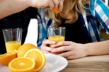 Couple drinking orange juice