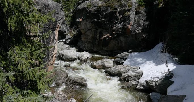Roaring Fork River Colorado Rocky Mountains. Grottos climbing cliffs swimming hole at Devil's Punchbowl. Scenic water and forest landscape for nature and recreation.