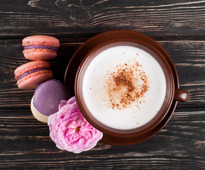Color macaroons on wood desk