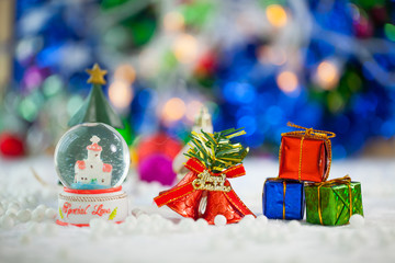 Christmas props decorations on christmas snow field background with copy space.Merry Christmas and happy new year concept. © ekachai050050