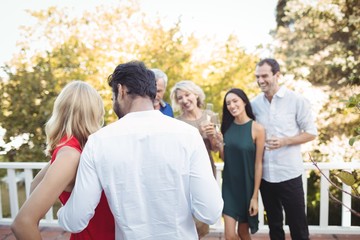 Group of friend having champagne in balcony
