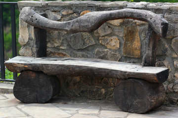 Wooden bench made of thick logs