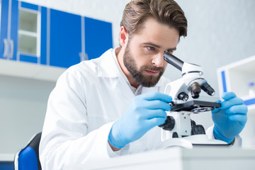 Serious smart scientist focusing in his work