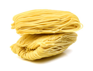 Egg noodles on a white background