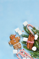 New Year's blue background with ginger biscuits, sweets and sweets. Happy New Year and Merry Christmas.