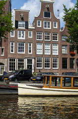 Naklejka premium Traditional old buildings in Amsterdam