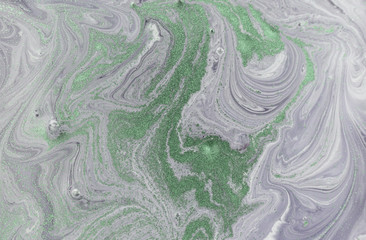 Marble abstract acrylic background. Nature green and purple marbling artwork texture. Golden glitter.