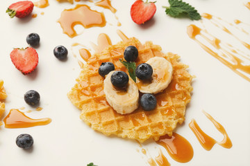 Waffles with fruits, breakfast background