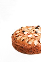 Dundee -Scottish Xmas fruit cake isolated on white, selective focus