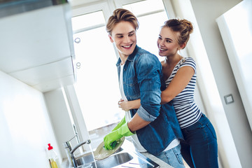 Couple is doing cleaning at home