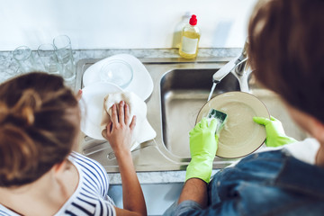 Couple is doing cleaning at home