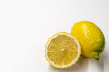 Textured ripe slice of lemon citrus fruit isolated on white background.