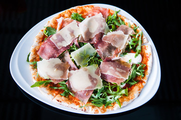Italian pizza slice pamaham arugula and margarita sauce horizontal top angle shot