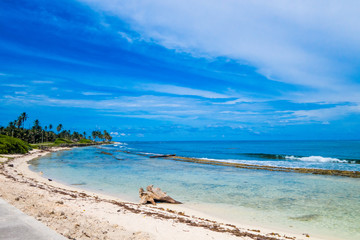 Beautiful outdoor view of white sand, turquoise water and beautiful sunny day in San Andres beach, Colombia
