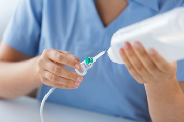 close up of nurse preparing drop counter