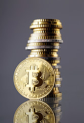 Bitcoin and coins stacked