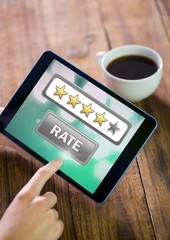Hands holding tablet with review star ratings