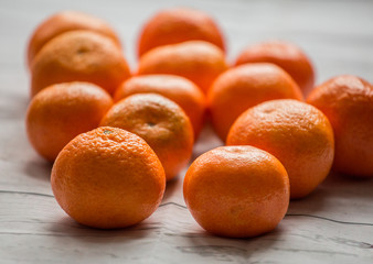 mandarin close up on white wooden background