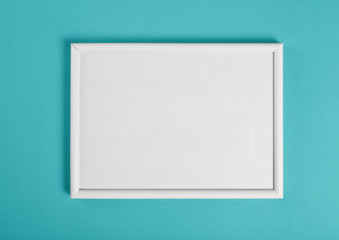 White wooden frame for painting or picture on green background