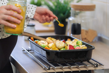 Pregnant woman spice up healthy  meal with tumeric