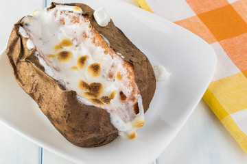 Baked sweet potato with marshmallows.