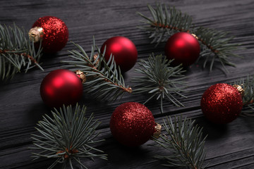 spruce branches and shiny red  New Year's toys balls