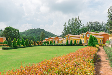 Orange home tuscany style in khaoyai resort at nakhonratchasima,vivid,sunny day,beautiful sky