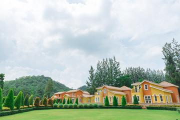 Orange home tuscany style in khaoyai resort at nakhonratchasima,vivid,sunny day,beautiful sky