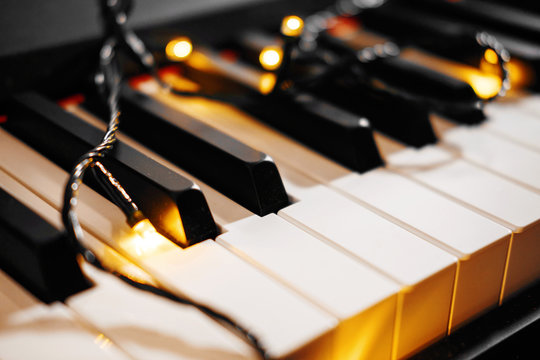 piano keys with all the Christmas lights