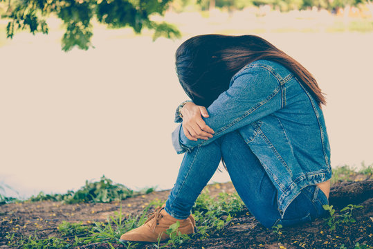 Beautiful thai woman very sad from unrequited love,rethink,think over,vintage style,dark tone,broken heart,asian girl,sad woman concept