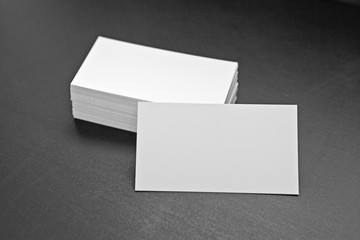 Blank business cards on a black background