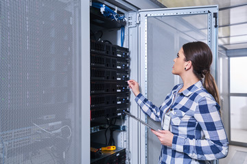 female technician working on server maintenance