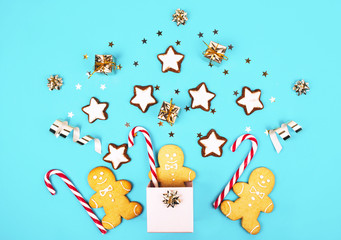 Christmas composition with gingerbread man in a pink box.