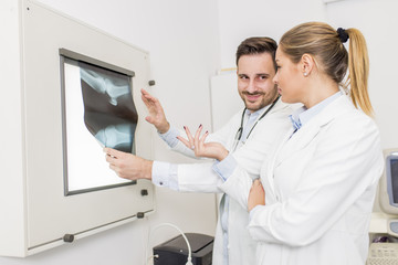 Fototapeta premium Doctors examining an x-ray of the patient