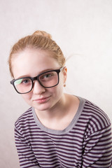 portrait of beautiful girl with glasses smiling