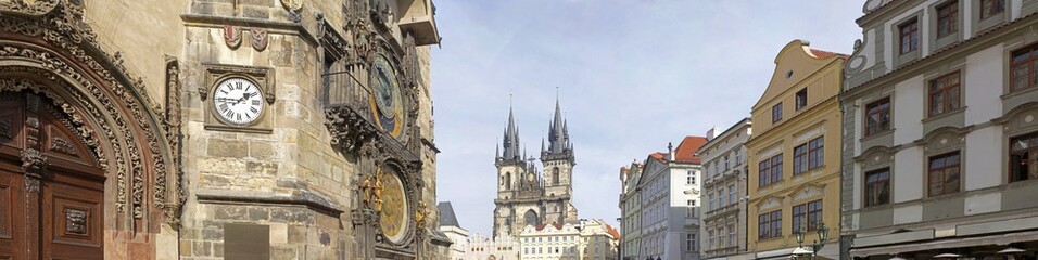 Fototapeta na wymiar Panoramic view of Astronomical clock (Orloj), and Church of Our Lady before Tyn in Old Town Square , Prague, Czech Republic