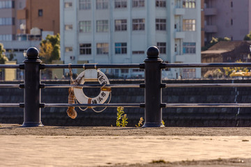 YOKOHAMA, JAPAN, NOV. 12th, 2015. Sculpture of girl and seagulls with Landmark Tower to rear Minato Mirai Yokohama Japan