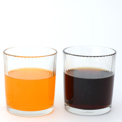 Different drinks in two glasses. Water in a glass on a white background. Drink. Glass