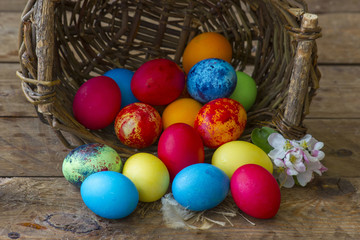 Fototapeta na wymiar Happy Easter, colorful eggs in a basket