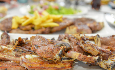 Obraz na płótnie Canvas roasted beef and lamb served on a restaurant table